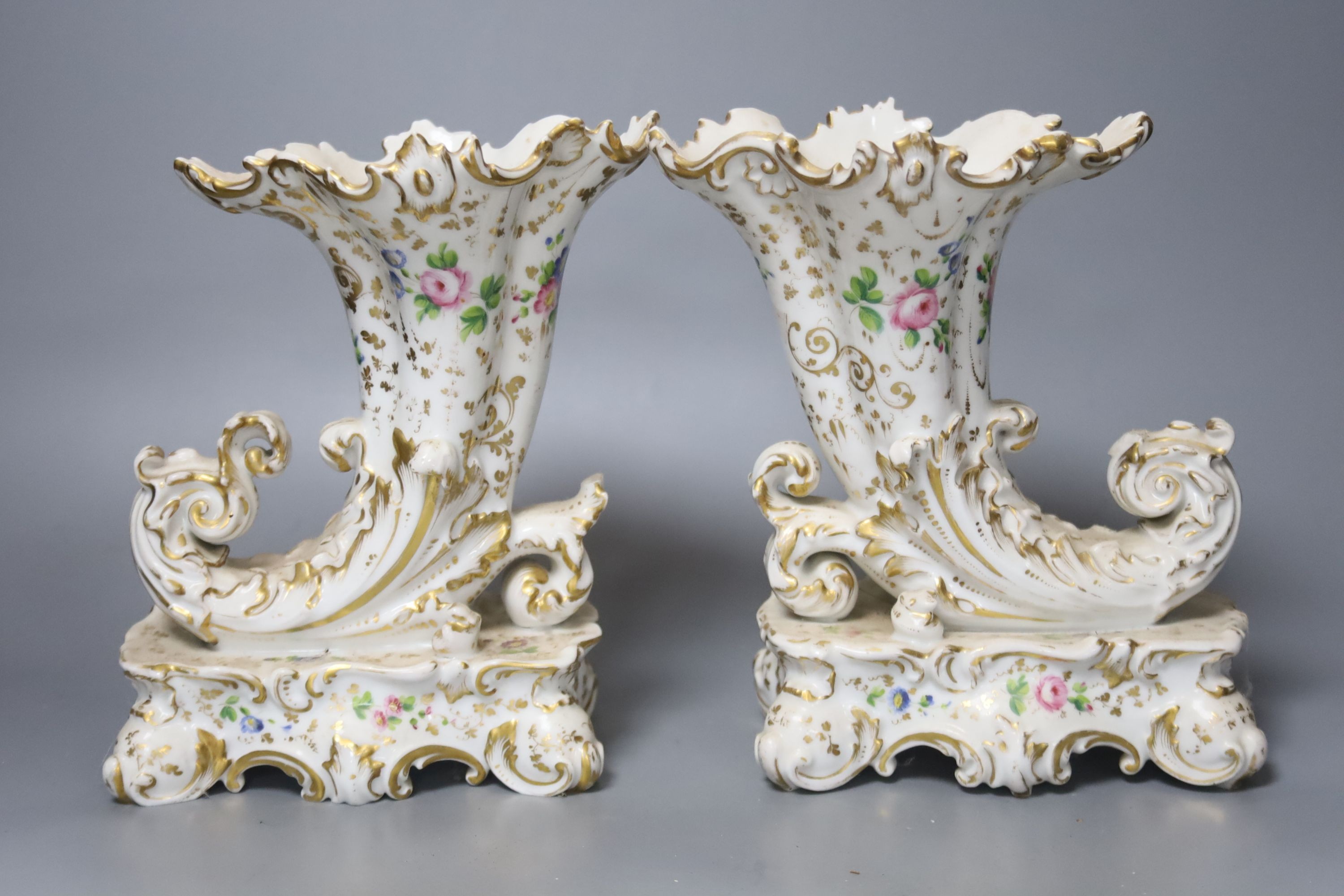 A pair of mid 19th century Jacob Petit cornucopia vases and a Worcester blue and white jug, tallest 20cm